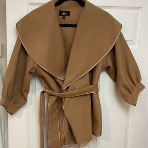 Soft camel colored jacket. 3/4 sleeves with satin like trim. Hidden snaps. Belt